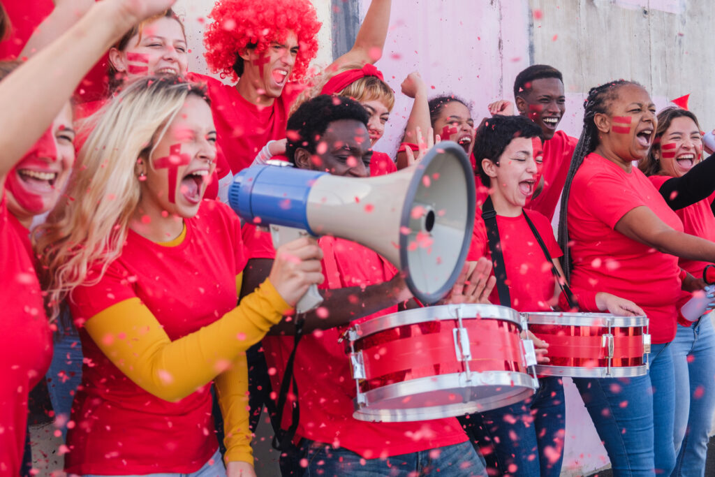 Students dress up in school colors to cheer on their sports team.